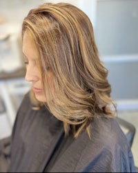 a woman with blonde hair in a salon